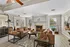 Inviting living room with cozy leather sofas, elegant fireplace, and stylish decor, showcasing a sophisticated and warm ambiance.