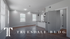 Bright and modern living space in Truesdale Building featuring sleek hardwood floors, open kitchen with bar seating, and stylish lighting accents.