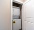 Convenient in-unit laundry with modern stackable washer and dryer in a sleek apartment setting.