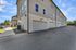 Modern apartment complex with spacious garages and well-maintained surroundings, perfect for convenient urban living.
