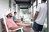 Inviting porch setting with people enjoying the serene outdoor area, complete with comfortable rocking chairs and a charming atmosphere.