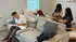 Inviting living space with a cozy gray sofa, perfect for study sessions or remote work, complemented by a soft, modern aesthetic.