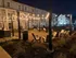 Charming and inviting outdoor courtyard illuminated by string lights, showcasing cozy seating areas perfect for relaxation and social gatherings.