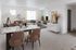 Dining and living area with large windows in an Erin Hills Estates townhome