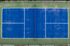 Aerial view of the blue pickleball court at Erin Hills Estates
