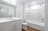 Apartment bathroom with quartz vanity and tub-shower at Tradition Pointe