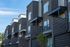 Modern brick townhome exteriors with private balconies at Erin Hills Estates.