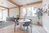 Clubhouse dining and work nook with a round table at The Residences at Victory Ranch in Idaho Falls