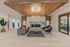 Clubhouse lounge with a wood-beam ceiling, chandelier and fireplace at The Residences at Victory Ranch in Idaho Falls