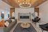 Clubhouse lounge seating area with a modern fireplace at The Residences at Victory Ranch in Idaho Falls