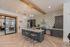 Clubhouse kitchen with a large island and patterned tile backsplash at The Residences at Victory Ranch in Idaho Falls