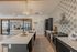 Clubhouse chef kitchen with island seating and range hood at The Residences at Victory Ranch in Idaho Falls