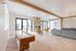 Clubhouse game area with shuffleboard table and stone fireplace at The Residences at Victory Ranch in Idaho Falls