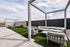 Outdoor pergola lounge with sofas and turf at The Residences at Victory Ranch in Idaho Falls