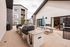 Outdoor grilling patio with picnic tables near the clubhouse at The Residences at Victory Ranch in Idaho Falls