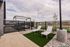 Pool deck with lounge chairs and turf at The Residences at Victory Ranch in Idaho Falls