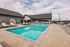 Resort-style swimming pool with sun deck and lounge chairs at The Residences at Victory Ranch in Idaho Falls