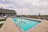 Swimming pool and clubhouse on a sunny day at The Residences at Victory Ranch in Idaho Falls