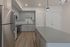 3-bedroom apartment kitchen with stainless steel appliances and island at The Residences at Victory Ranch in Idaho Falls