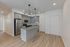 3-bedroom apartment kitchen island with pendant lights at The Residences at Victory Ranch in Idaho Falls