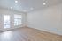 1-bedroom apartment living room with balcony doors at The Residences at Victory Ranch in Idaho Falls