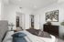 Furnished primary suite with views of the bathroom and walk-in closet at The Residences at Victory Ranch in Idaho Falls