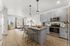 Furnished open kitchen, breakfast bar and living room at The Residences at Victory Ranch in Idaho Falls