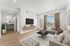 Furnished living room with sectional sofa and large windows at The Residences at Victory Ranch in Idaho Falls