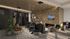 Modern apartment lobby with cozy seating, ambient lighting, and a stylish fireplace, perfect for relaxation and conversations.
