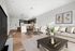 Bright and modern open-concept living space featuring a sleek kitchen, stylish dining area, and cozy living room with elegant decor.