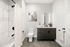 Modern bathroom with sleek tile, elegant vanity, and stylish fixtures for a luxurious feel.