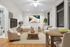 Elegant studio apartment with modern decor, featuring a cozy sleeping area, stylish seating, and a charming dining table, complemented by large windows and natural light.