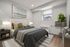Bright and inviting bedroom with a plush bed, elegant decor, and a window view. Features modern artwork and ambient lighting.