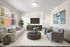 Bright and inviting living room featuring a modern aesthetic with cozy seating, elegant decor, and ample natural light through large windows.