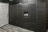 Modern package locker system with digital interface in a sleek black finish, enhancing convenience and security.