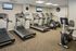 Modern fitness center featuring multiple treadmills and exercise bikes, offering a vibrant space for a healthy lifestyle.