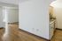 Bright open space featuring elegant wood flooring, cozy kitchen nook with modern amenities, and spacious storage closets.