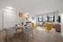 Modern apartment interior showcasing a bright open-plan living and dining area with stylish furniture, large windows, and a cozy kitchen.