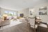 Bright and inviting living space with modern decor, featuring a cozy dining area and open kitchen design.