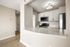 Modern kitchen with sleek white cabinets, stainless steel appliances, and a quartz countertop for a sophisticated look.