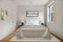 Elegant bedroom with modern decor, featuring a plush bed and stylish artwork, filled with natural light from a large window.