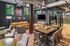 Contemporary communal lounge with stylish seating, vibrant artwork, and natural light in a modern apartment setting.