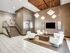 Elegant apartment lobby with modern lighting, chic white seating, and stylish decor, featuring a sleek elevator and polished staircase.
