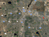 Satellite view of Denver and surrounding areas highlighting Aurora, showing a vibrant community with access to major highways and natural parks.