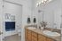 Elegant bathroom with dual sinks, granite countertops, and stylish decor perfectly combining functionality with modern aesthetics.
