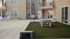 Charming apartment courtyard featuring a ping pong table, cozy seating area, and stylish patio vibes.
