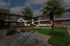 Charming courtyard at The Howard Urban Apartments featuring vibrant seating, lush greenery, and a serene atmosphere.