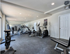 Modern fitness center equipped with cutting-edge cardio machines and ample space for workouts.