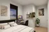 Contemporary bedroom showcasing a cozy bed, sleek workstation with computer, stylish wall art, and vibrant indoor plant, exuding modern elegance.