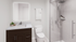 Modern bathroom with sleek glass shower, elegant dark wood vanity, and stylish backlit mirror.